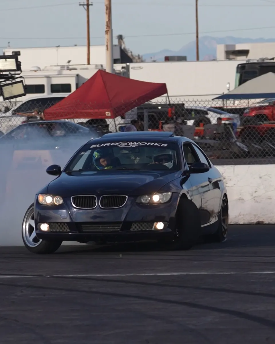 A customer E92 with a EuroWorks windshield banner drifting at Firebird Motorsports Park