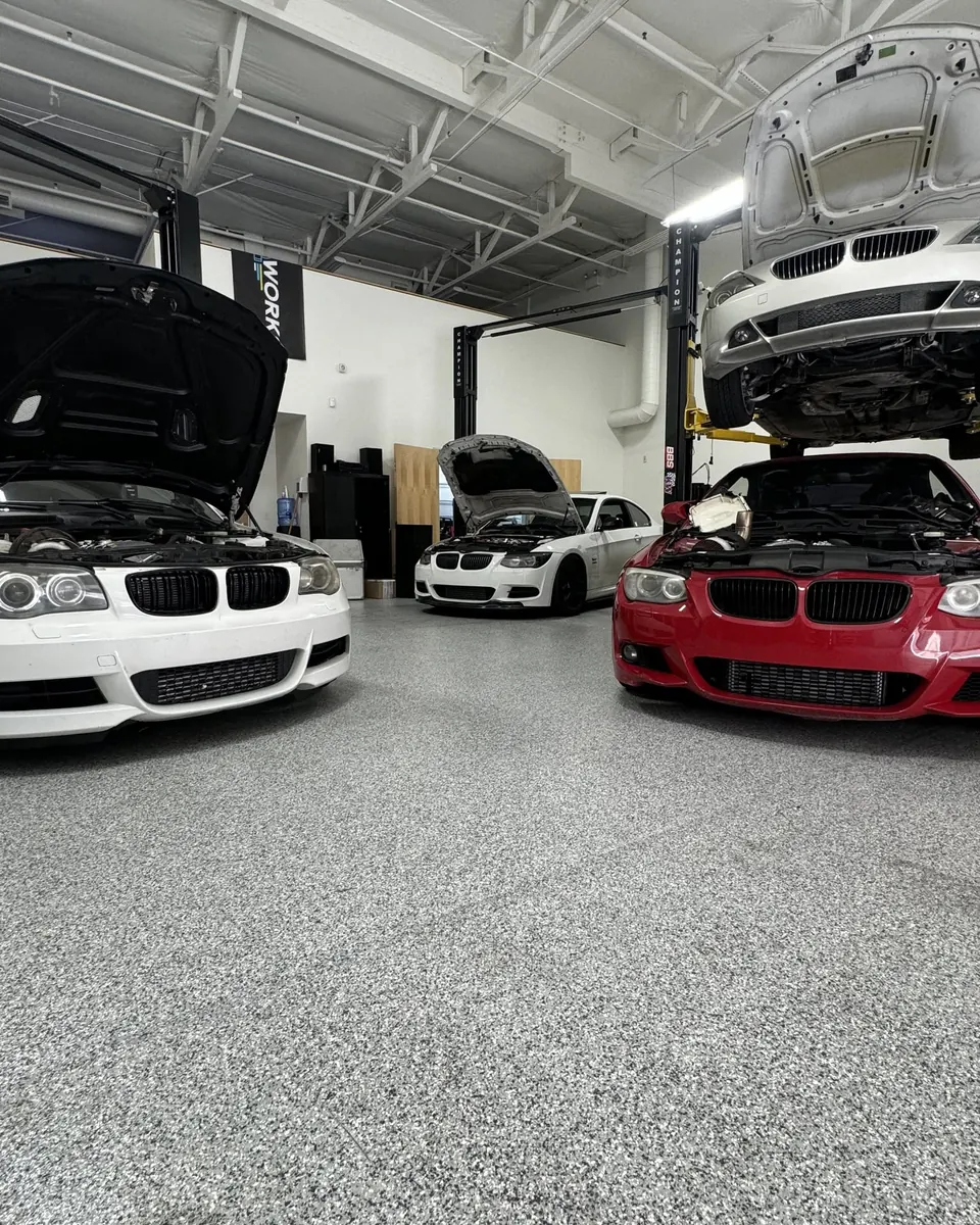Inside the EuroWorks shop: BMWs in for service on the floor and up on the lifts