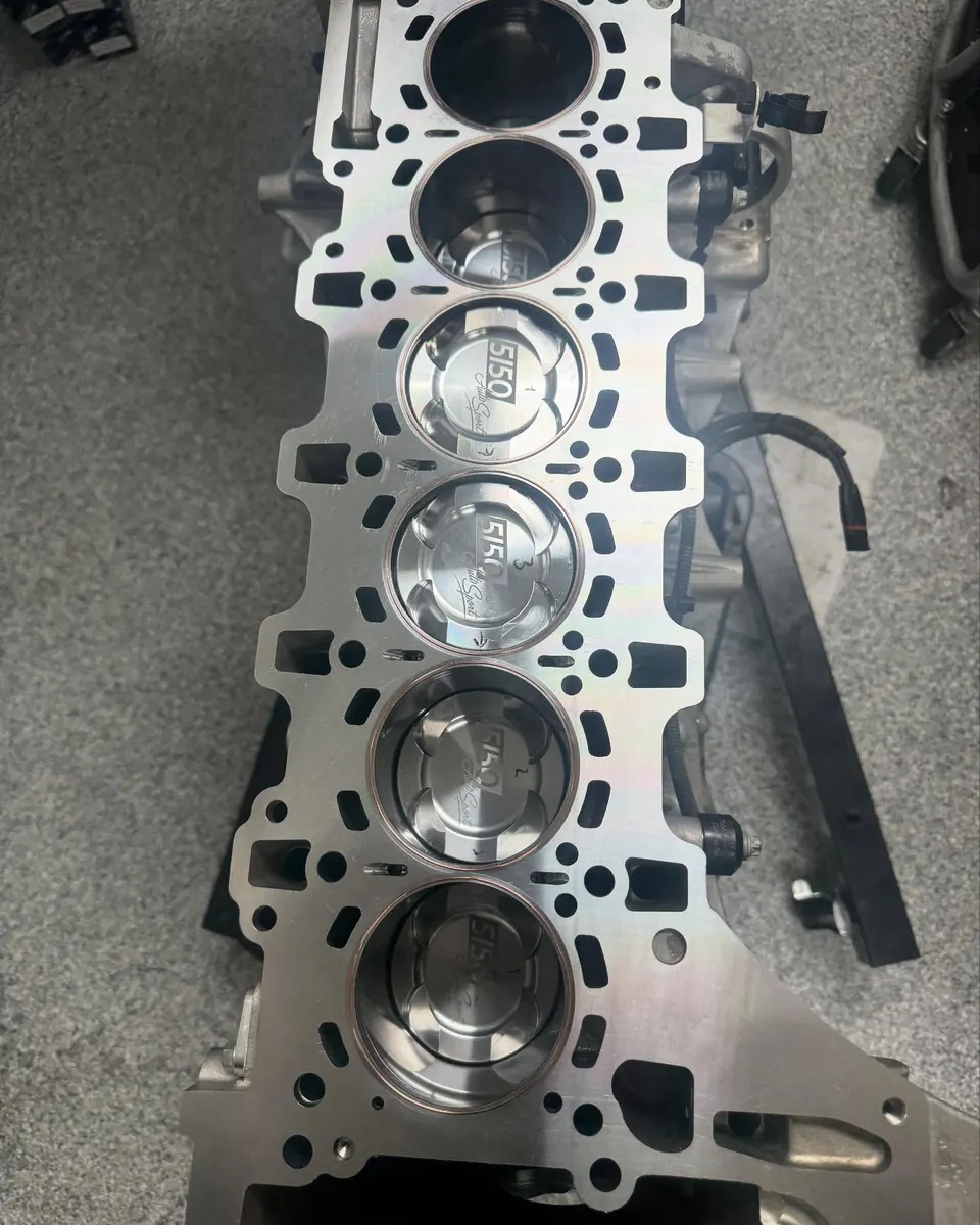 A built S55 block with forged pistons on the EuroWorks bench